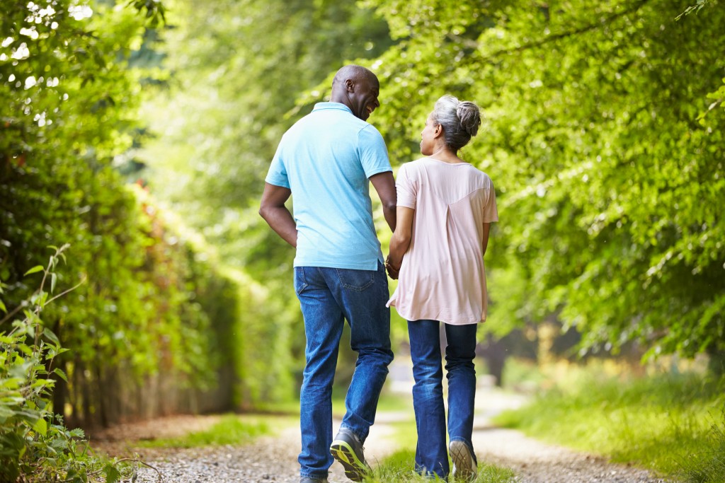 Couple walks down trail together